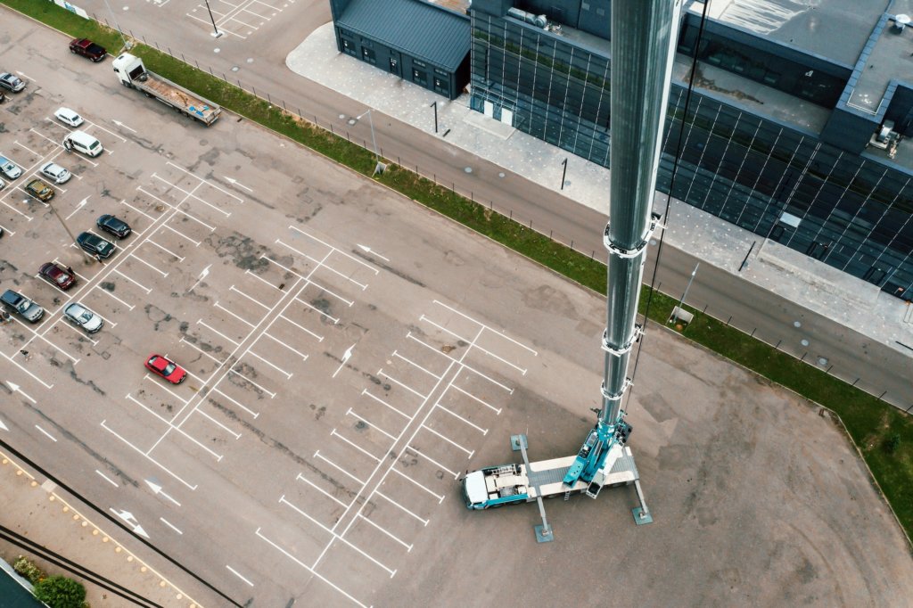 view from the height of the Car heavy crane that stands open in the Parking lot and ready to work